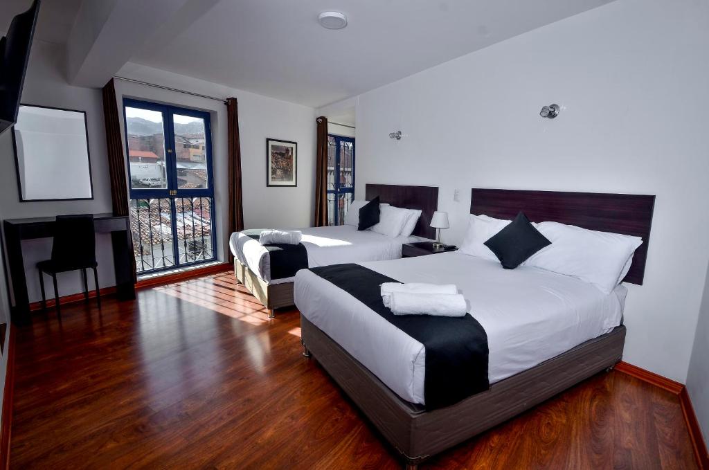 Postel nebo postele na pokoji v ubytování Ankawa Hotel Boutique