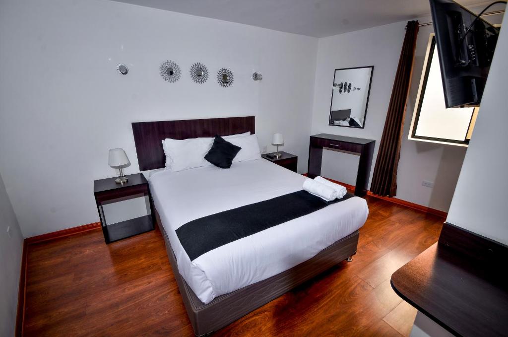 Postel nebo postele na pokoji v ubytování Ankawa Hotel Boutique