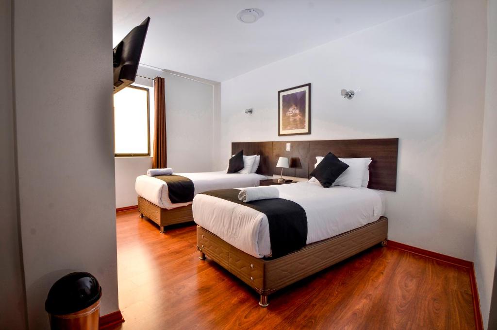 Postel nebo postele na pokoji v ubytování Ankawa Hotel Boutique