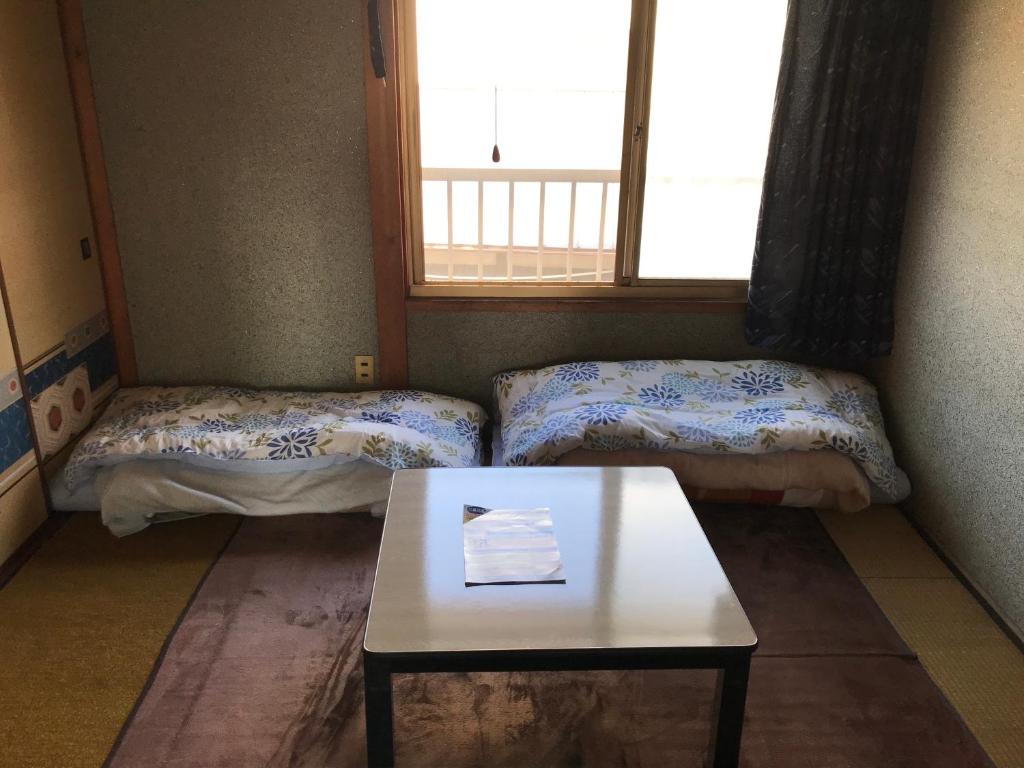 Postel nebo postele na pokoji v ubytování Guest House Salt Beach