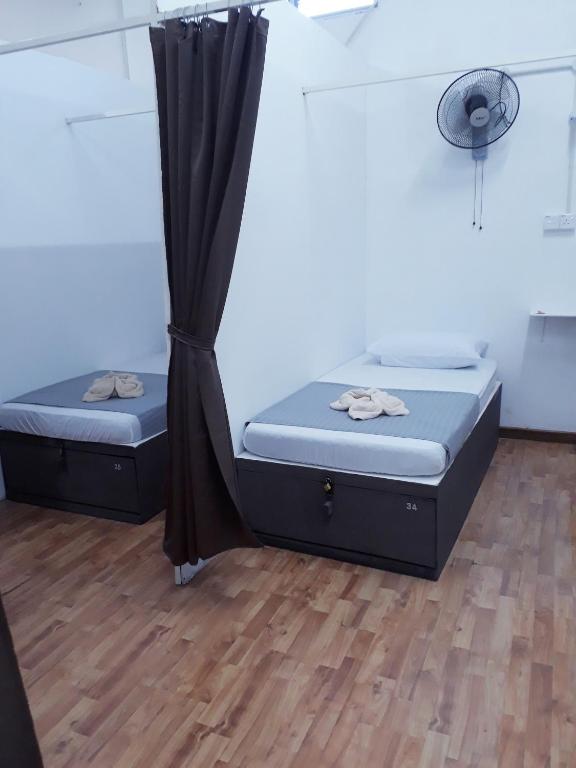 Postel nebo postele na pokoji v ubytování Hana's Dorm