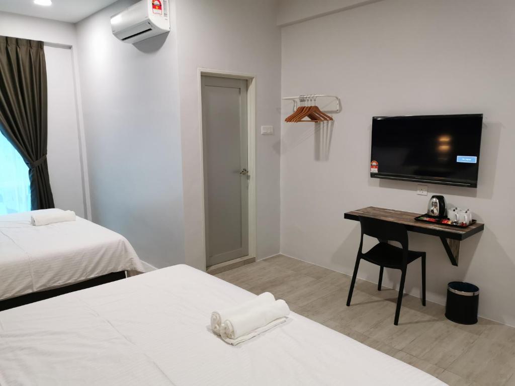Postel nebo postele na pokoji v ubytování L Hotel