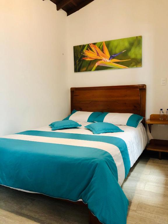 Postel nebo postele na pokoji v ubytování 40 Amigos Hotel
