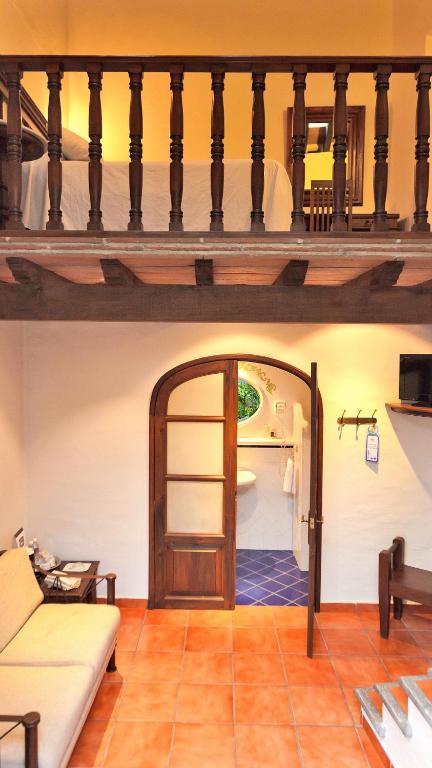 Postel nebo postele na pokoji v ubytování Meson del Alferez Coatepec