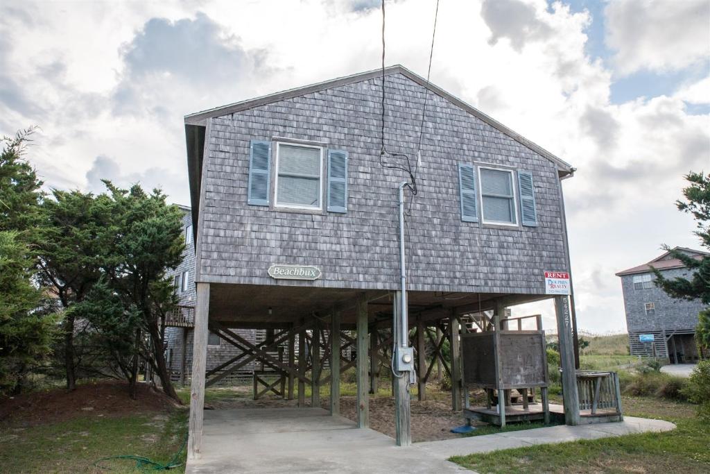 a house that is sitting on a sidewalk at Shoresurf House 54227 in Frisco
