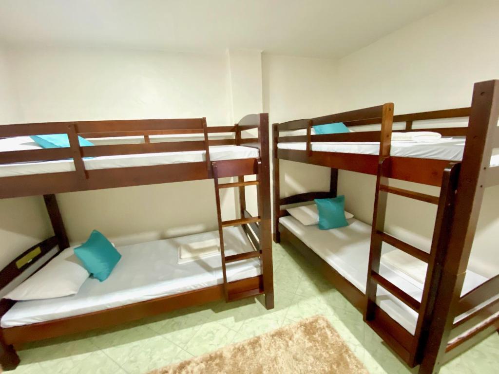 Postel nebo postele na pokoji v ubytování RQS Hostel