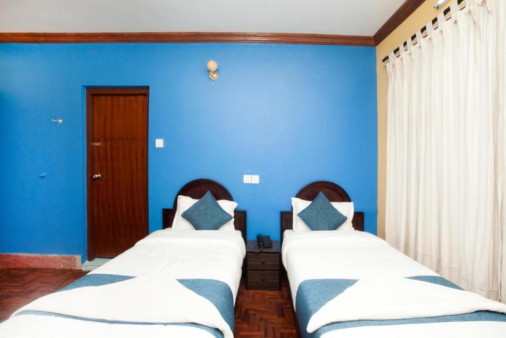 Postel nebo postele na pokoji v ubytování Hotel Green Horizon