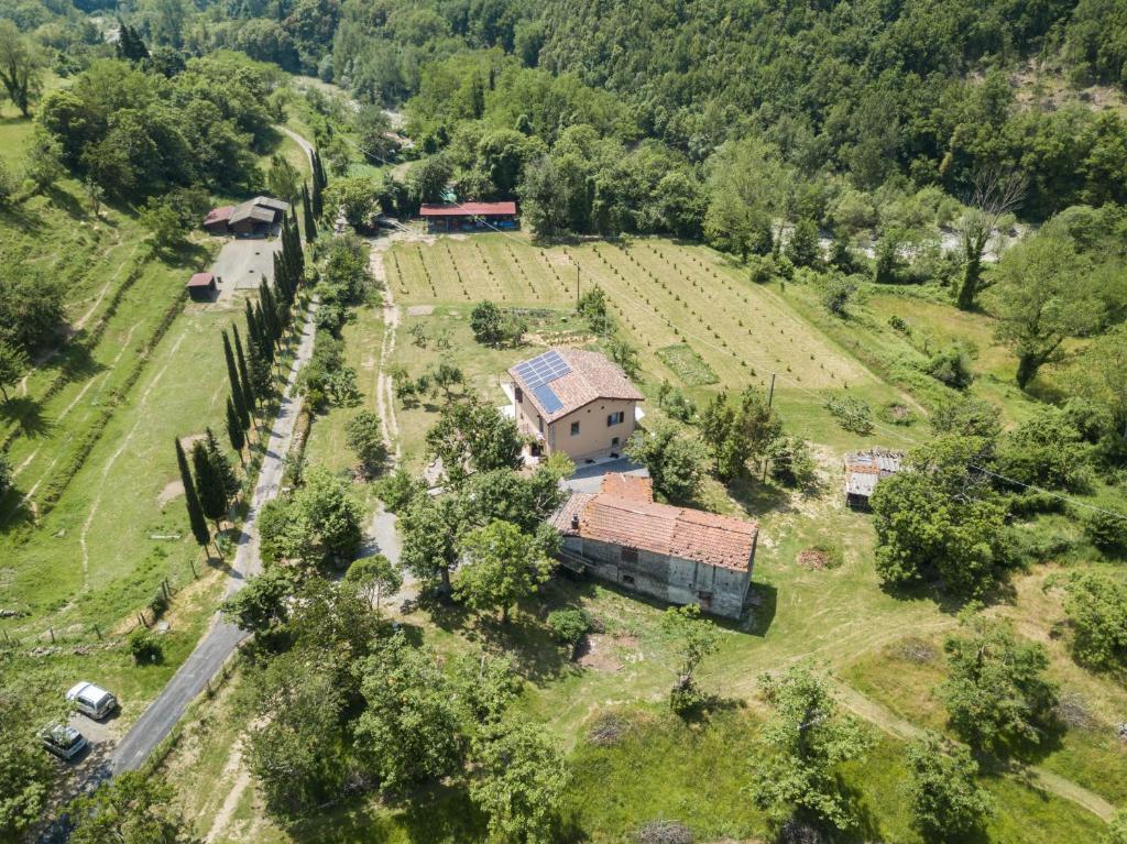 an aerial view of a house in a field at Podere Groppini in Fivizzano