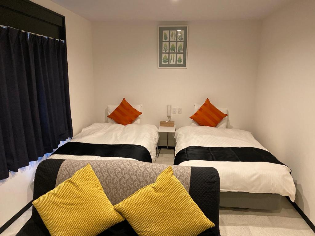 Postel nebo postele na pokoji v ubytování Hotel Pagoda