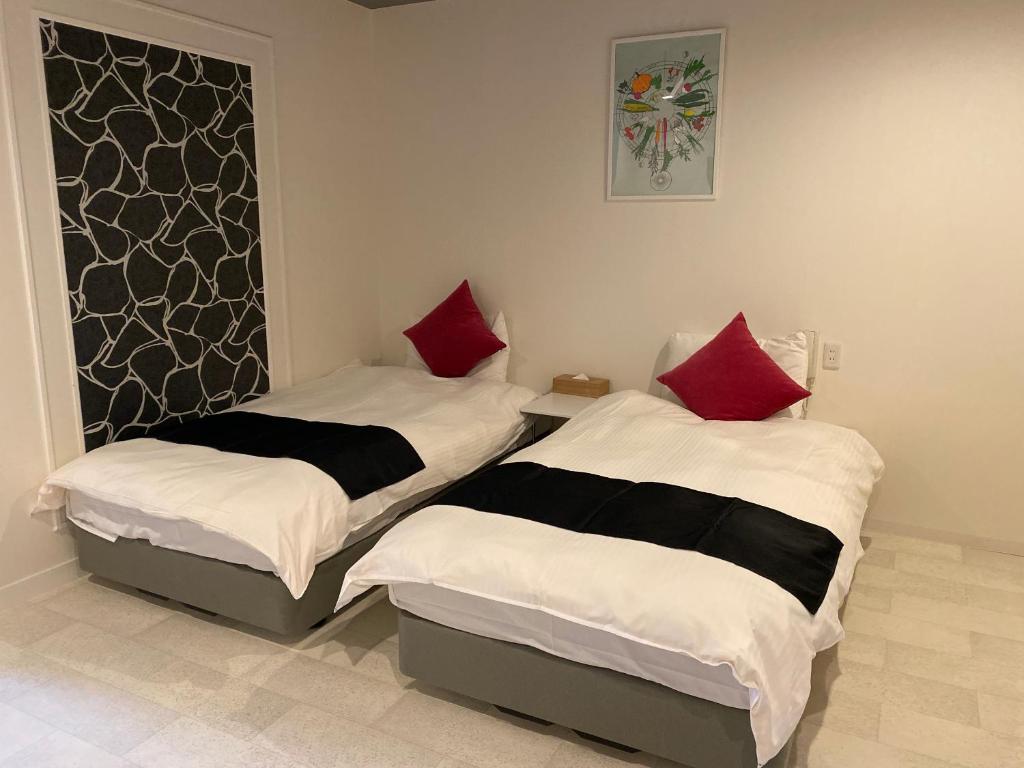 Postel nebo postele na pokoji v ubytování Hotel Pagoda