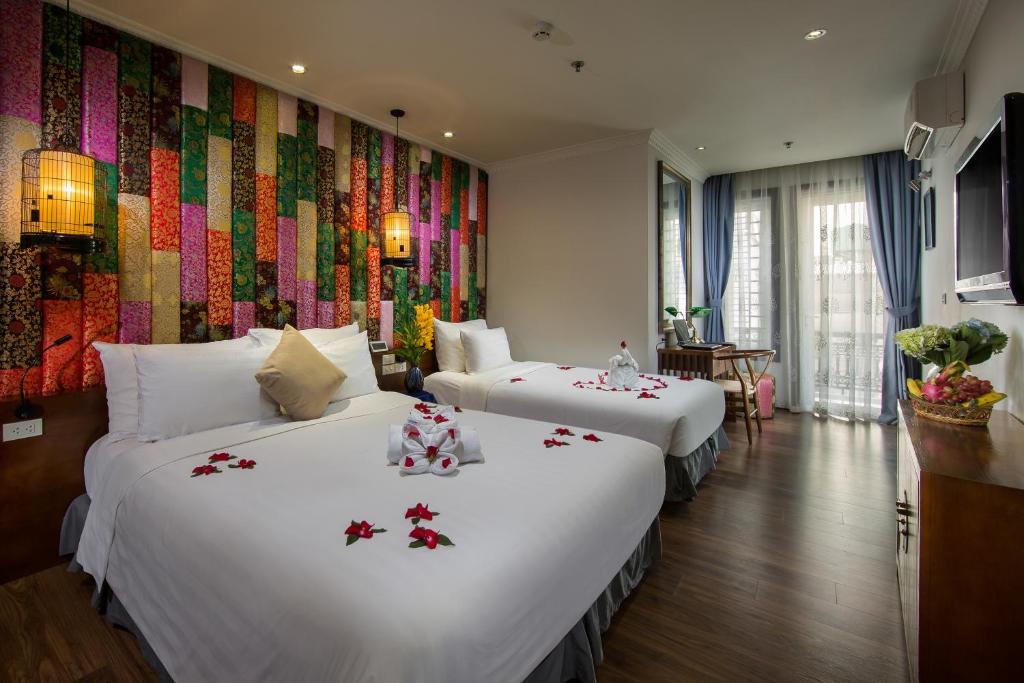 Postel nebo postele na pokoji v ubytování Hanoi Media Hotel & Spa