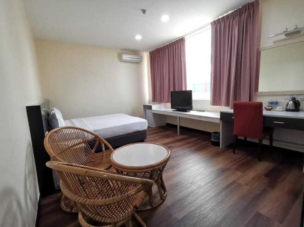 Postel nebo postele na pokoji v ubytování Prince Hotel