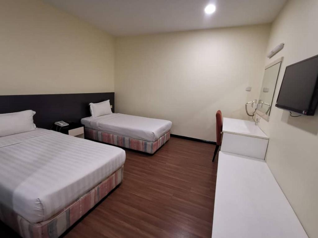 Postel nebo postele na pokoji v ubytování Prince Hotel