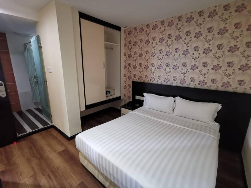 Postel nebo postele na pokoji v ubytování Prince Hotel