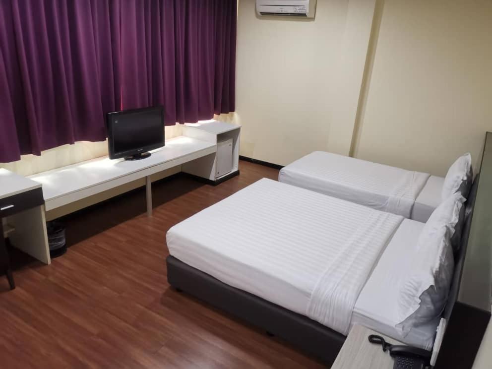Postel nebo postele na pokoji v ubytování Prince Hotel