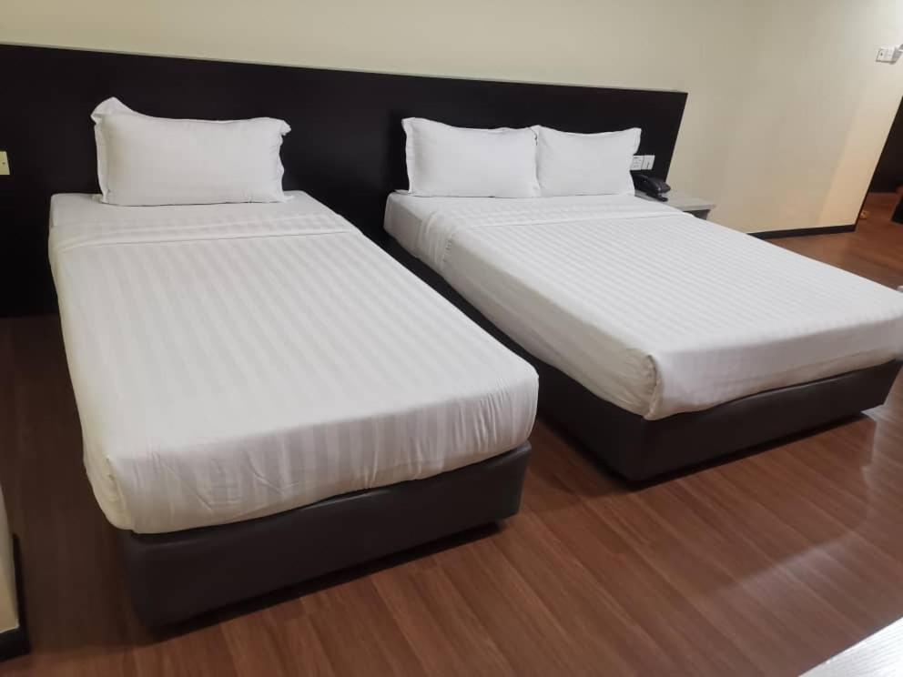 Postel nebo postele na pokoji v ubytování Prince Hotel