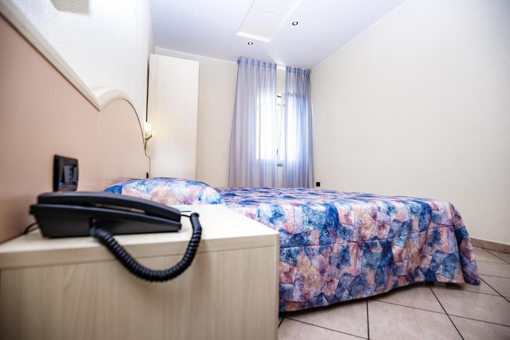 Кровать или кровати в номере Hotel Sileoni Dépendance Villa Antonio