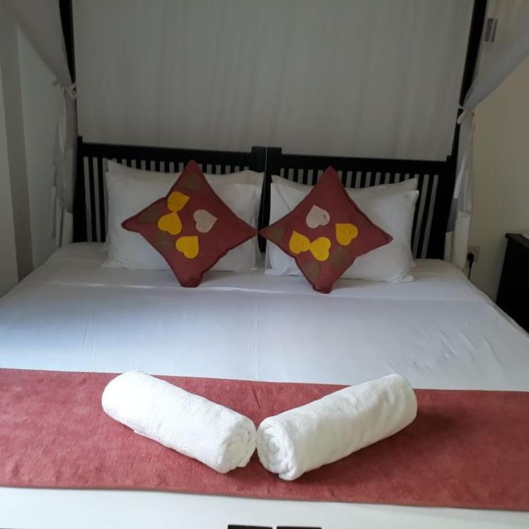 Postel nebo postele na pokoji v ubytování Apna Homestay Apartments