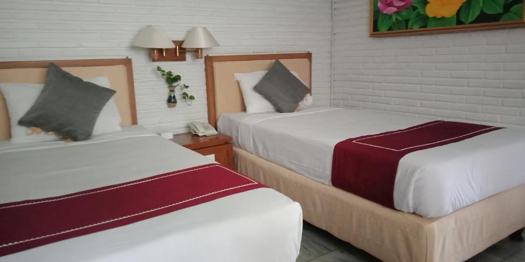 Postel nebo postele na pokoji v ubytování Puri Padi