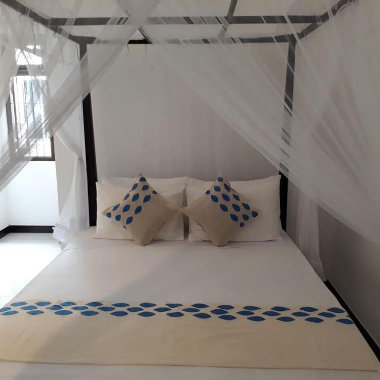 Postel nebo postele na pokoji v ubytování Apna Homestay Apartments