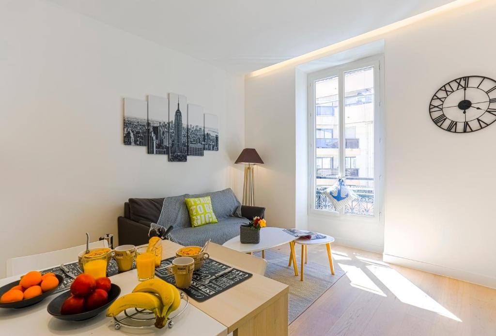 a living room with a couch and a table with fruit on it at MY CASA - 48 GIOFFREDO - NEAR PLACE MASSENA in Nice