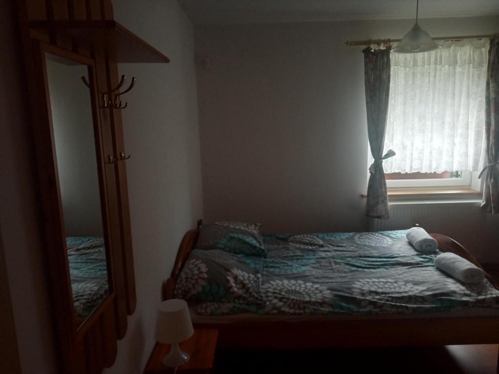 Posteľ alebo postele v izbe v ubytovaní Dom Pod Siódemką