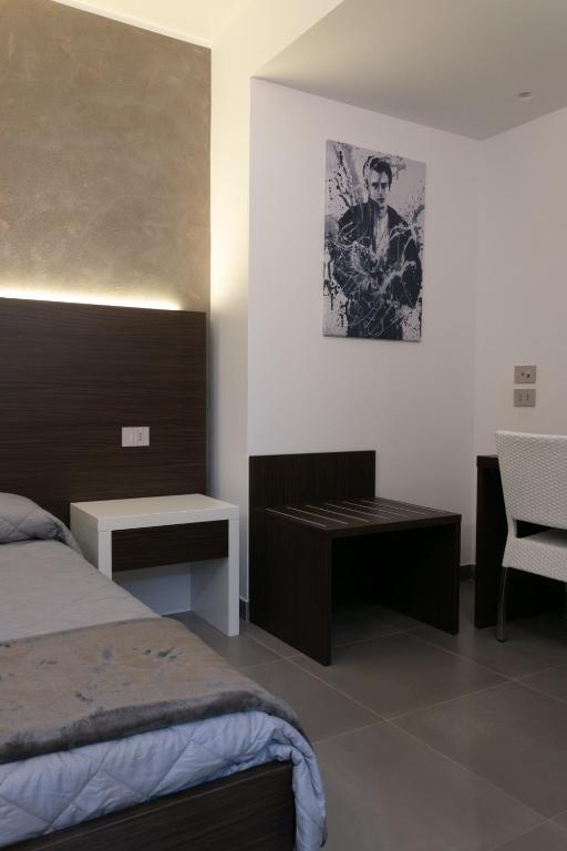 Postel nebo postele na pokoji v ubytování BRIGANTE SUITES