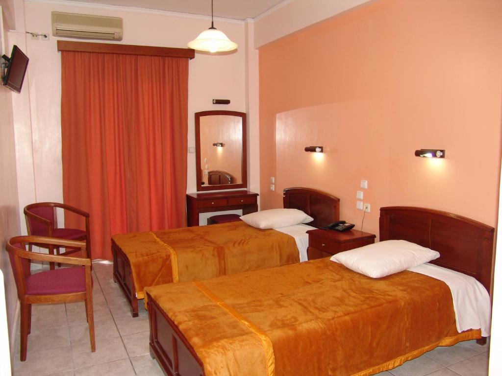 Postel nebo postele na pokoji v ubytování Hotel Cosmos