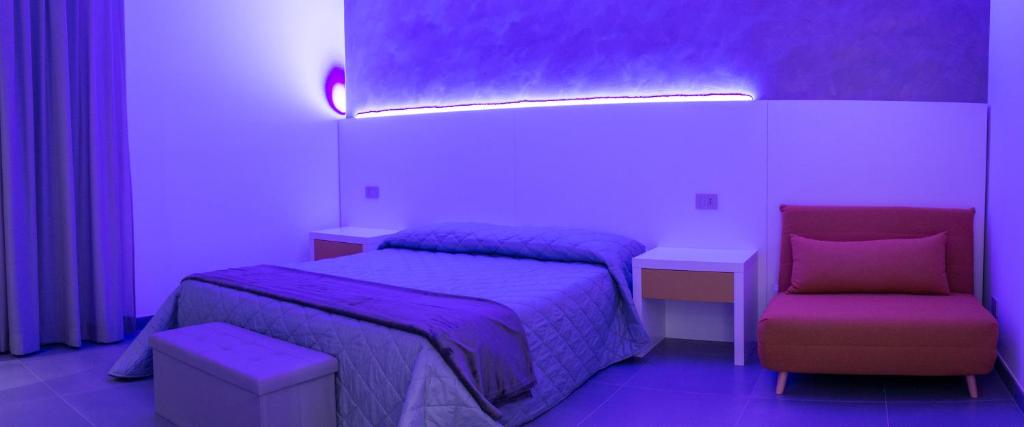 Postel nebo postele na pokoji v ubytování BRIGANTE SUITES