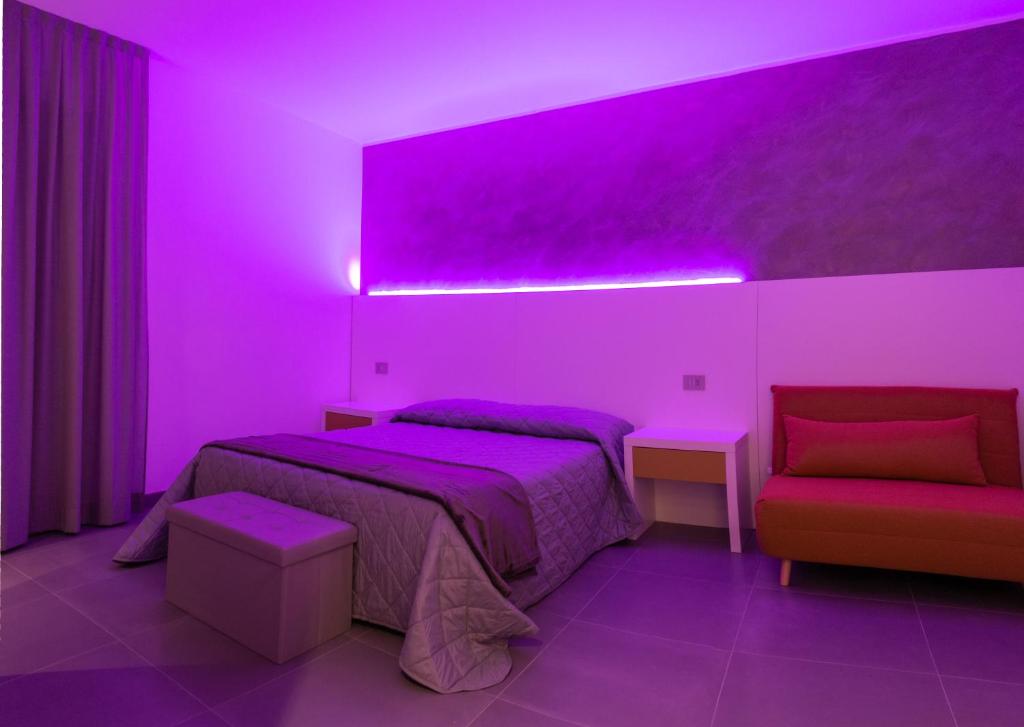 Postel nebo postele na pokoji v ubytování BRIGANTE SUITES