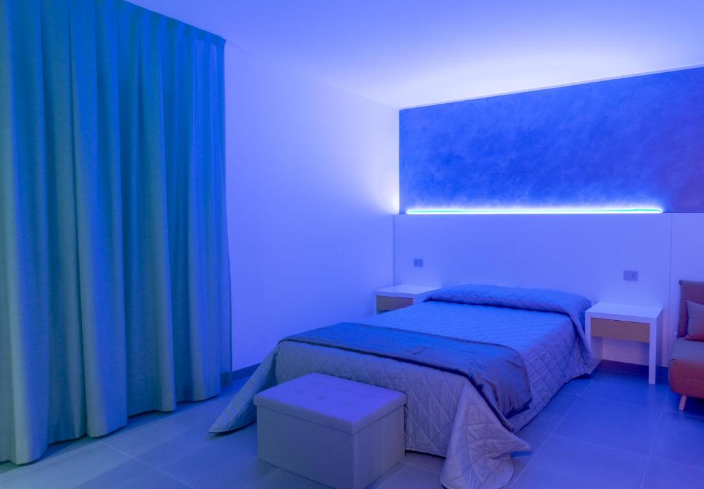 Postel nebo postele na pokoji v ubytování BRIGANTE SUITES