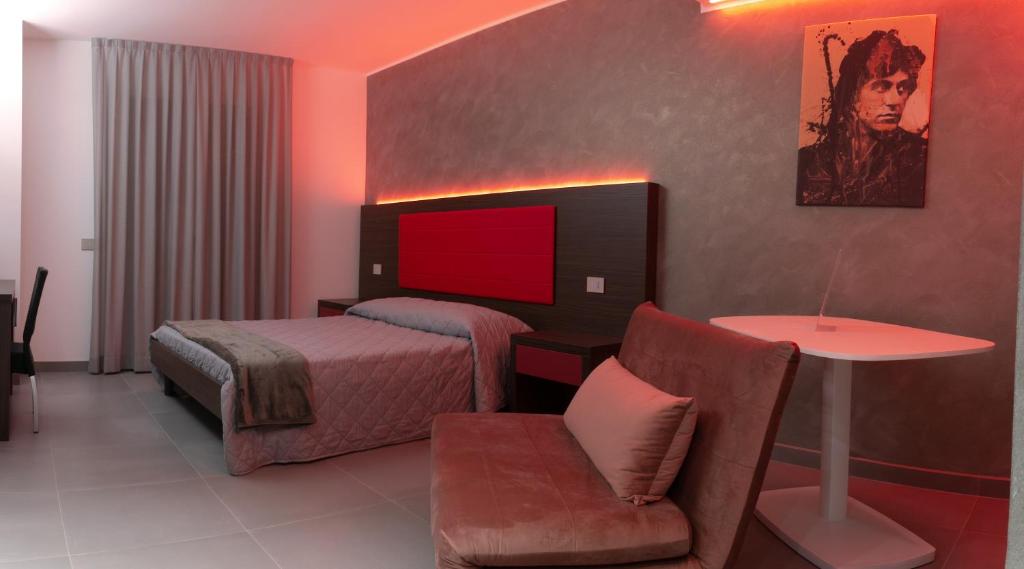 Postel nebo postele na pokoji v ubytování BRIGANTE SUITES