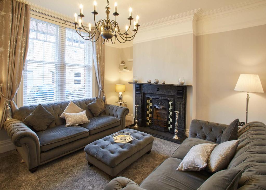 a living room with a couch and a fireplace at Host & Stay - Simba House in Saltburn-by-the-Sea