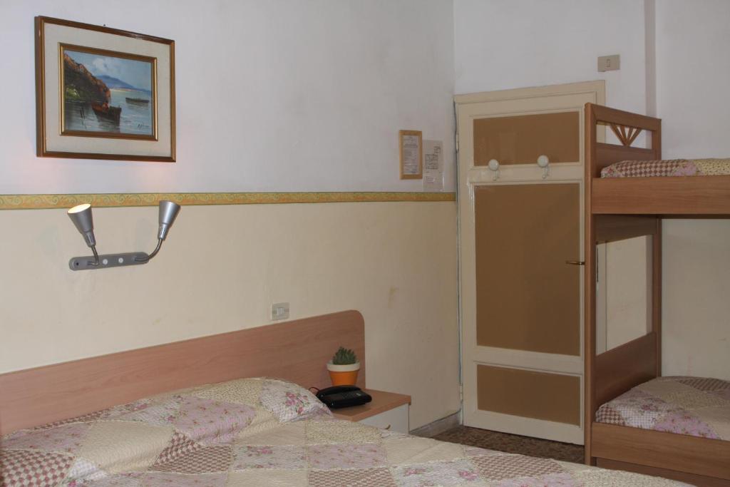 Postel nebo postele na pokoji v ubytování Hotel Ornella