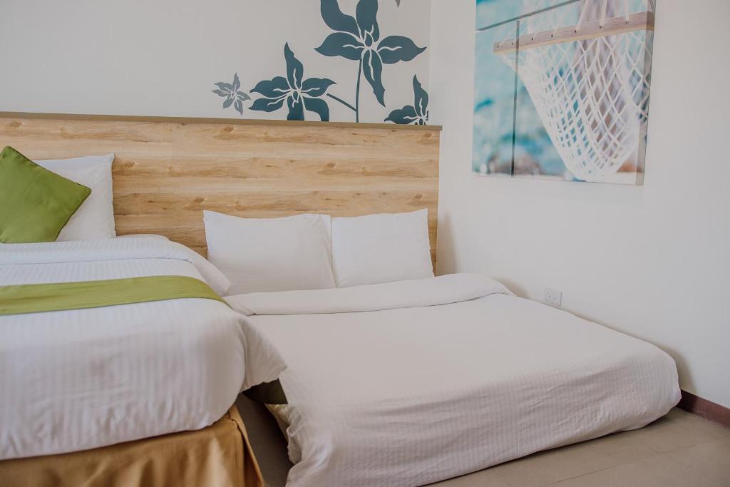 Postel nebo postele na pokoji v ubytování Azalea Hotels & Residences Boracay