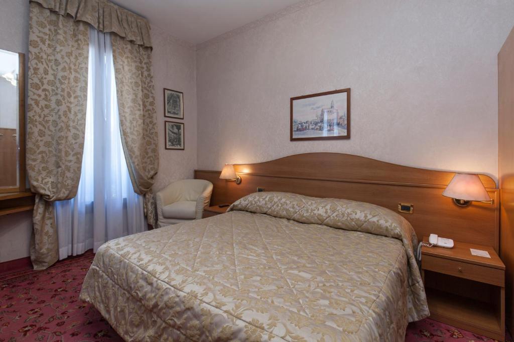 Postel nebo postele na pokoji v ubytování Hotel Riviera Venezia Lido