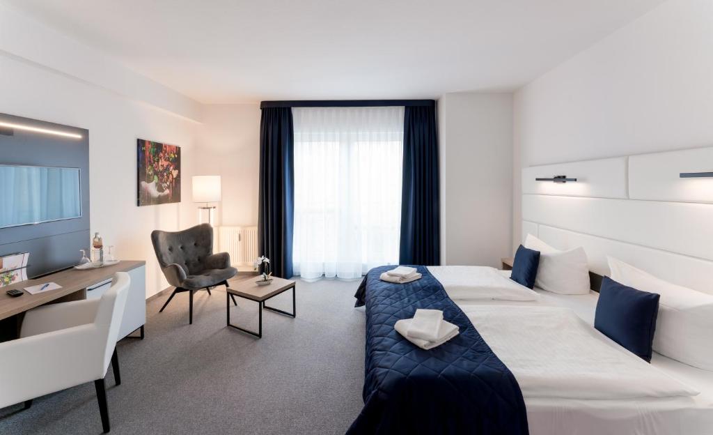Кровать или кровати в номере Hotel Stadtfeld