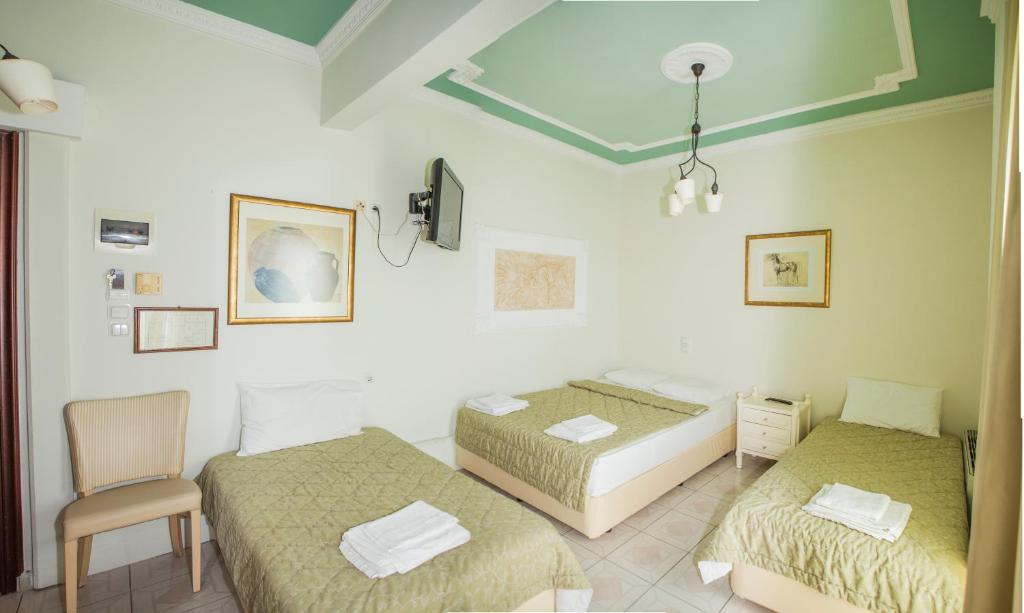 Postel nebo postele na pokoji v ubytování Hotel Zografos