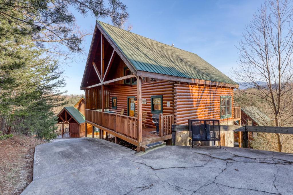a log cabin with a porch and a deck at Moonlight Retreat in Pigeon Forge