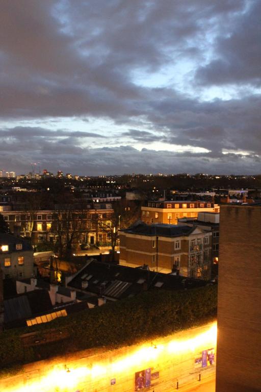 a view of a city at night with buildings at Stamford Bridge Hotel London in London