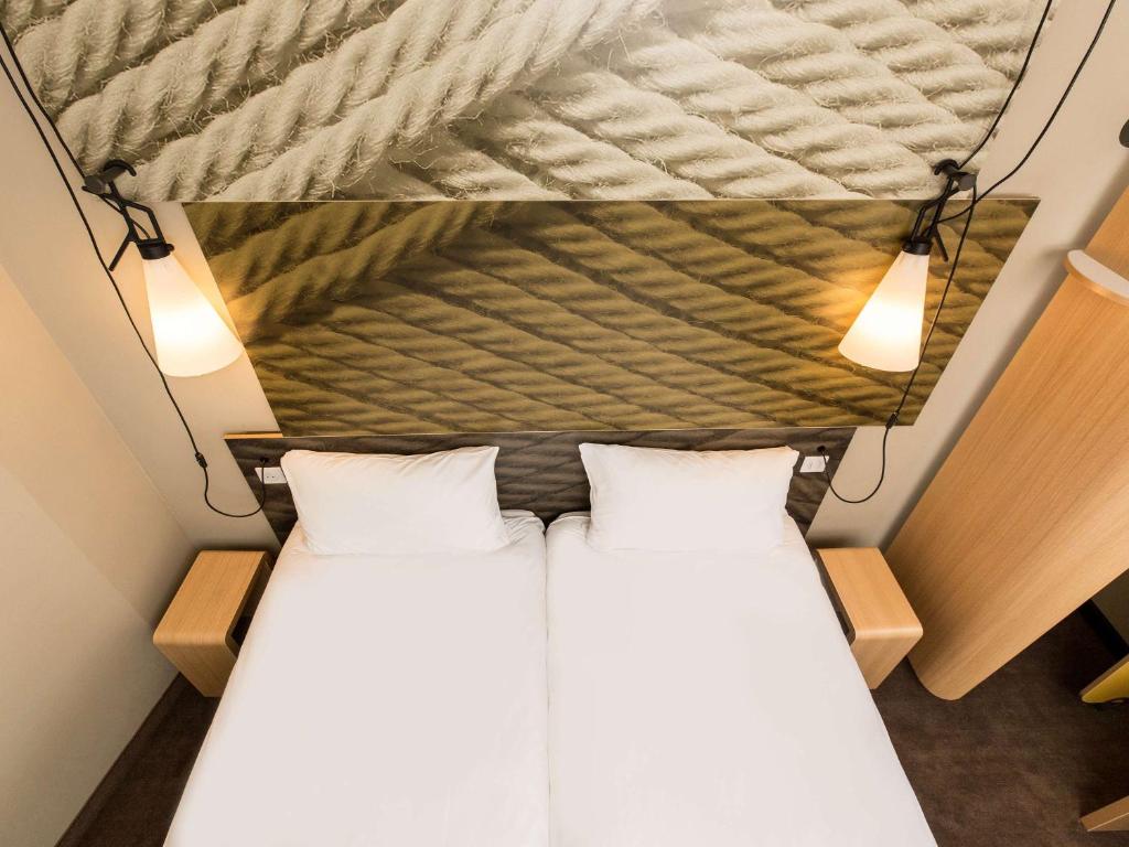 Postel nebo postele na pokoji v ubytování ibis Vilnius Centre