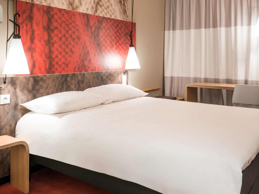 Postel nebo postele na pokoji v ubytování ibis Vilnius Centre