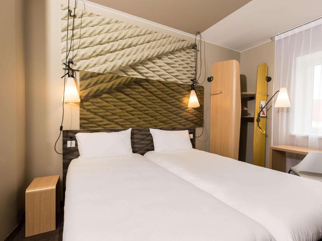 Postel nebo postele na pokoji v ubytování ibis Vilnius Centre