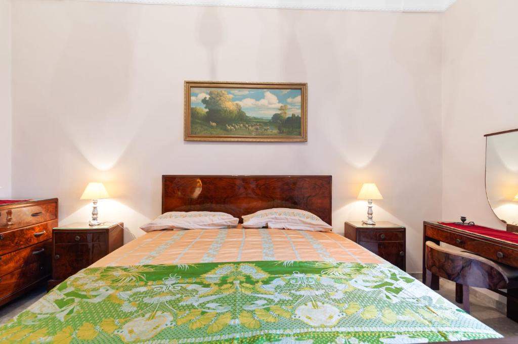 Postel nebo postele na pokoji v ubytování La dimora del Cavaliere di Squinzano