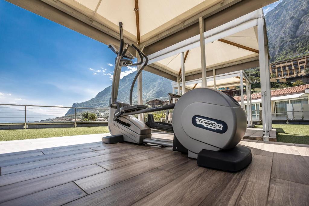 a gym with a treadmill on the floor of a building at Park Hotel Imperial in Limone sul Garda