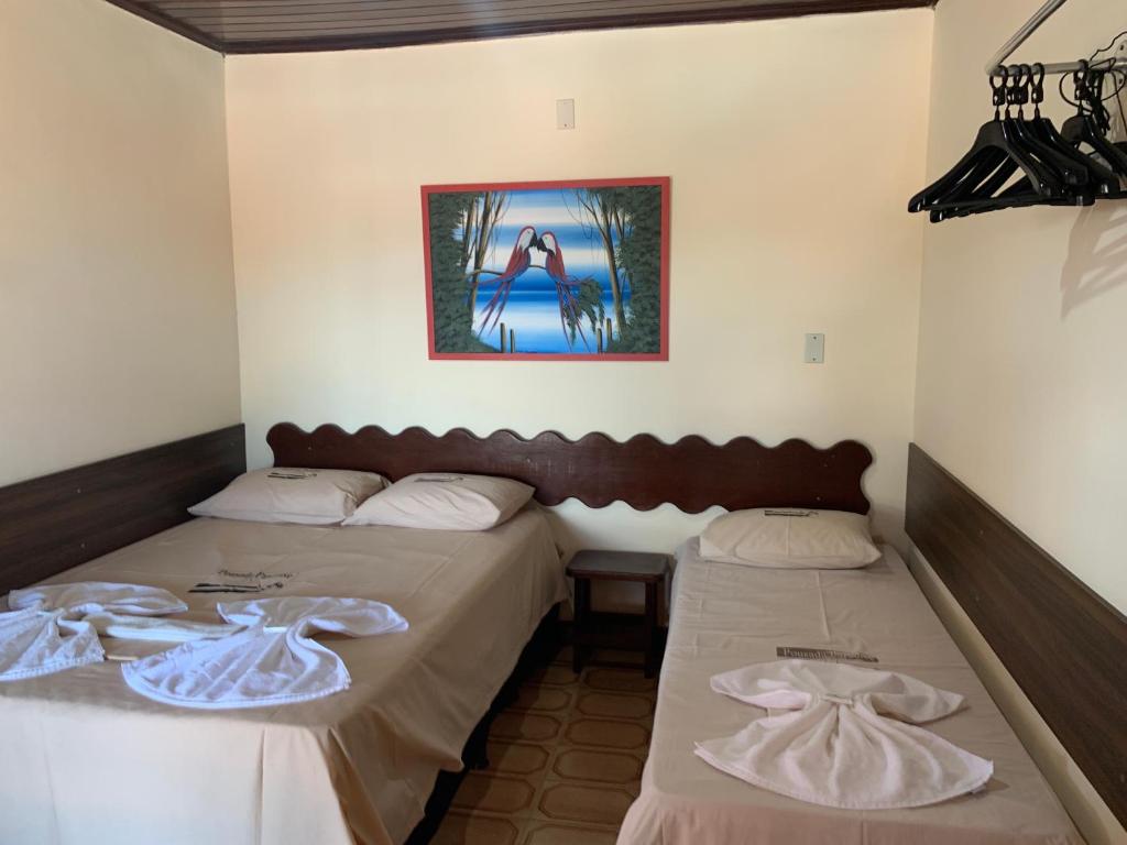 Postel nebo postele na pokoji v ubytování Pousada Paradise