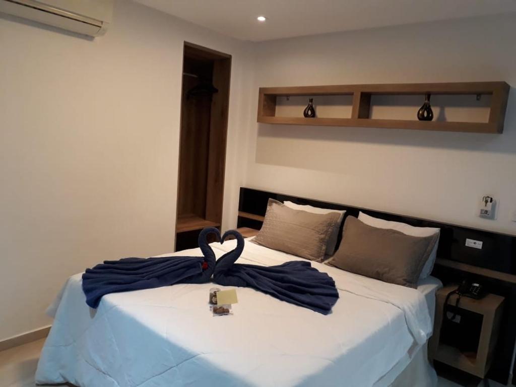 Cama o camas de una habitación en Hollyster Hotel