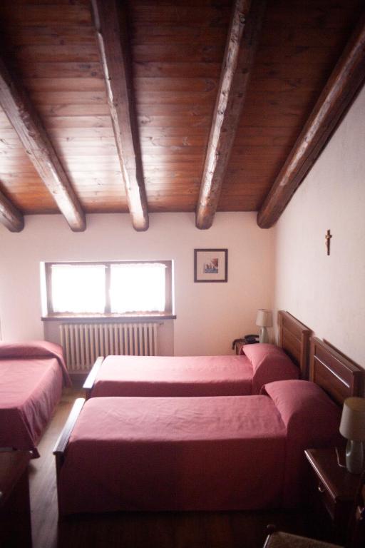 Postel nebo postele na pokoji v ubytování Hotel Ciocca