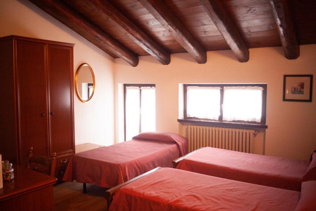 Postel nebo postele na pokoji v ubytování Hotel Ciocca