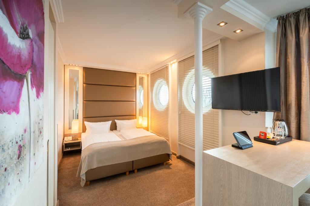 Postel nebo postele na pokoji v ubytování Thomas Hotel Spa & Lifestyle